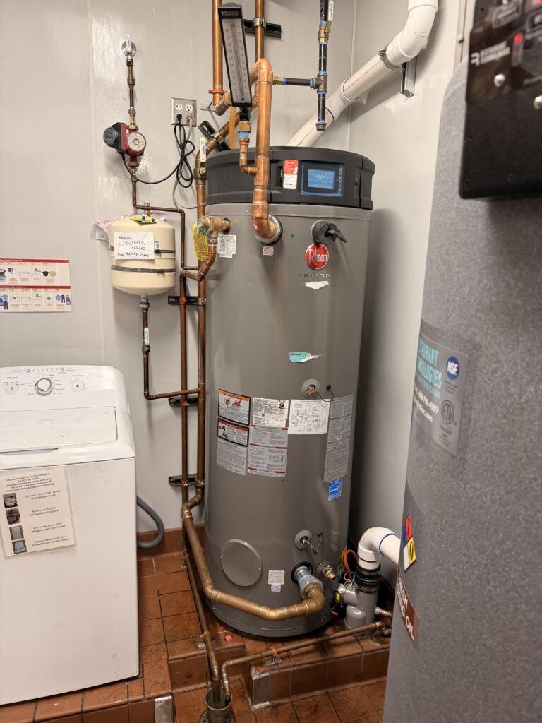 Commercial Rheem water heater and copper piping installed during an emergency replacement at a Queen Creek restaurant